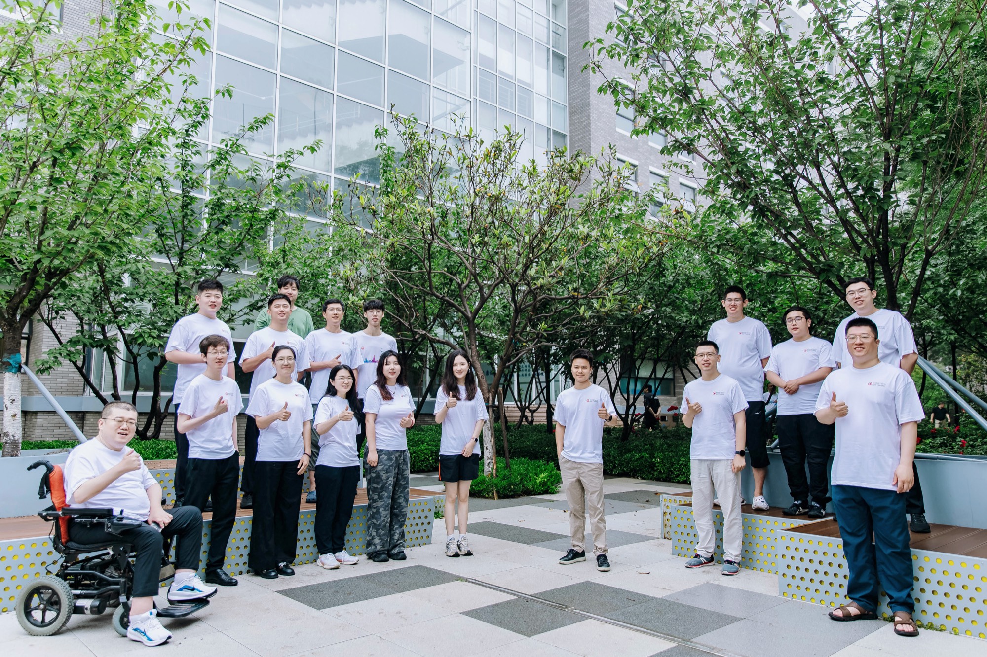 Shinetech Qingdao colleagues gathered around the office courtyard