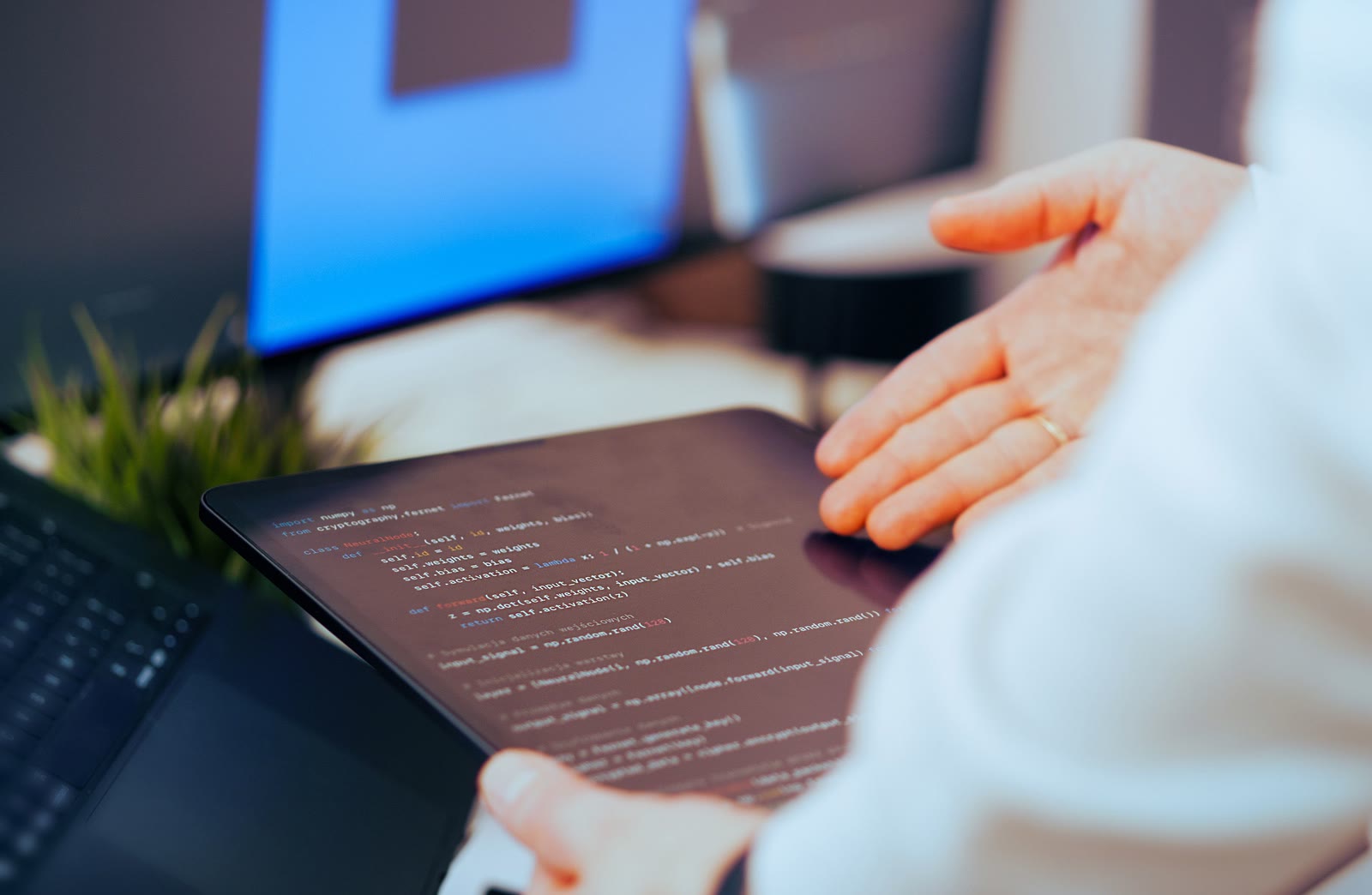 Developer reviewing code on a tablet for secure public access design
