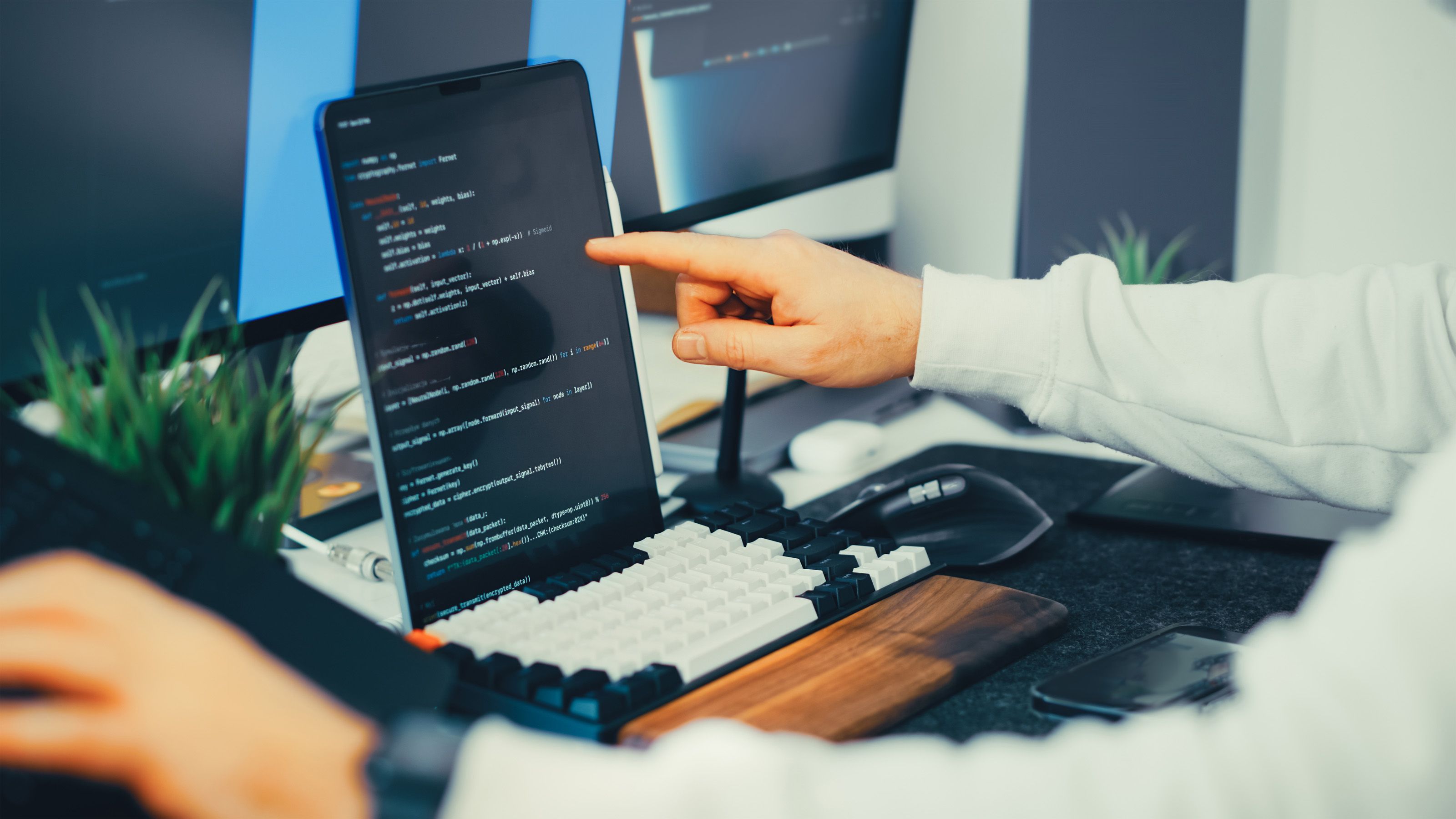 Engineer reviewing application code during an embedded technical support session