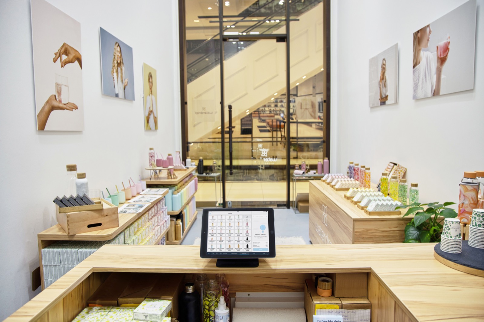 Retail store counter with POS tablet and product displays